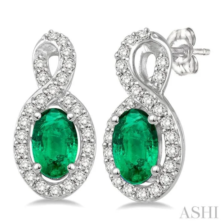 Women’s colorful earrings-5x3 MM Oval Cut Emerald and 1/5 Ctw Round Cut Diamond Earrings in 10K White Gold