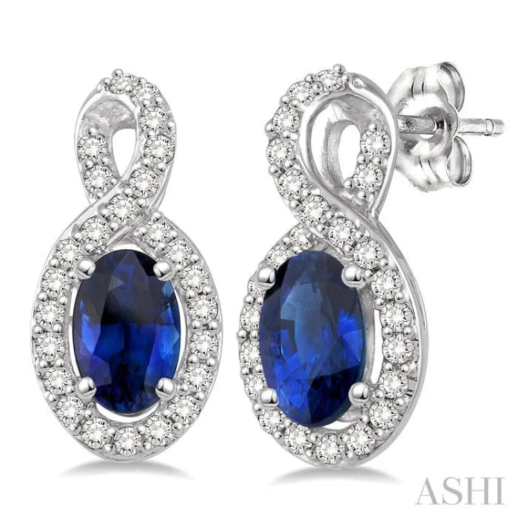 Women’s elegant diamond earrings-5x3 MM Oval Cut Sapphire and 1/5 Ctw Round Cut Diamond Earrings in 10K White Gold