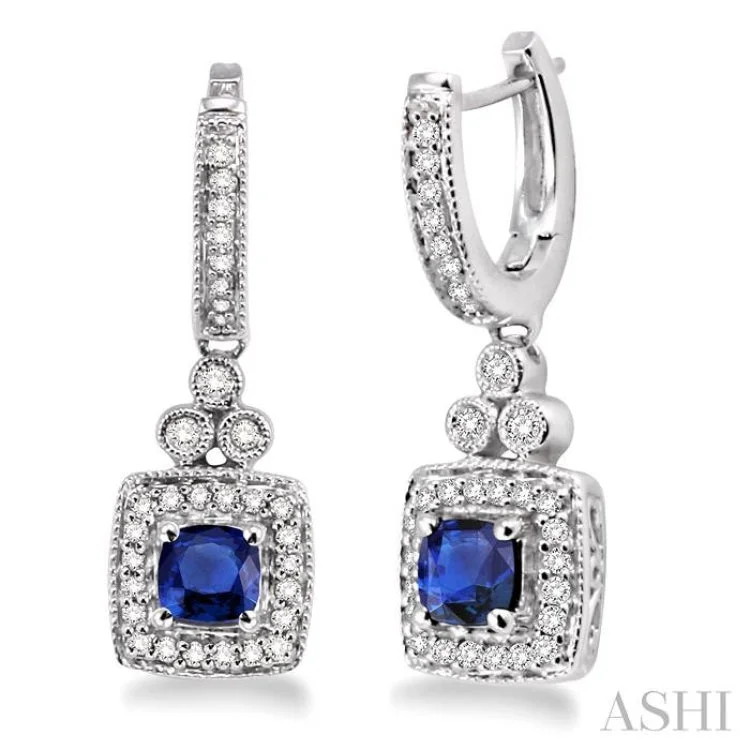 Women’s nature-themed earrings-4x4MM Cushion Cut Sapphire and 1/3 Ctw Round Cut Diamond Earrings in 14K White Gold