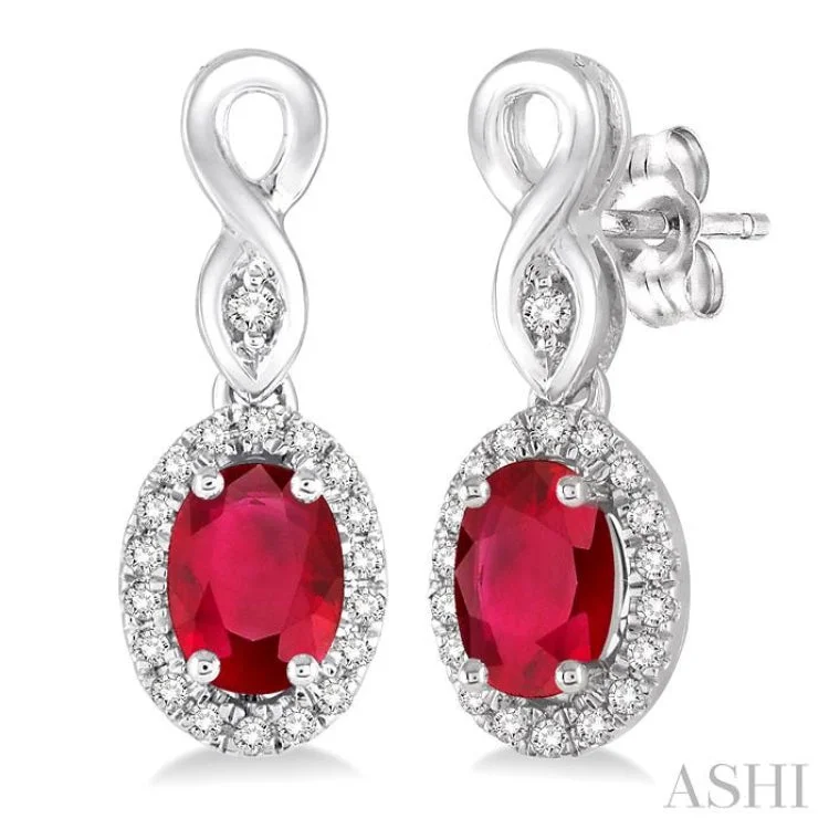 Women’s drop earrings-5x3 MM Oval Cut Ruby and 1/6 Ctw Round Cut Diamond Earrings in 14K White Gold