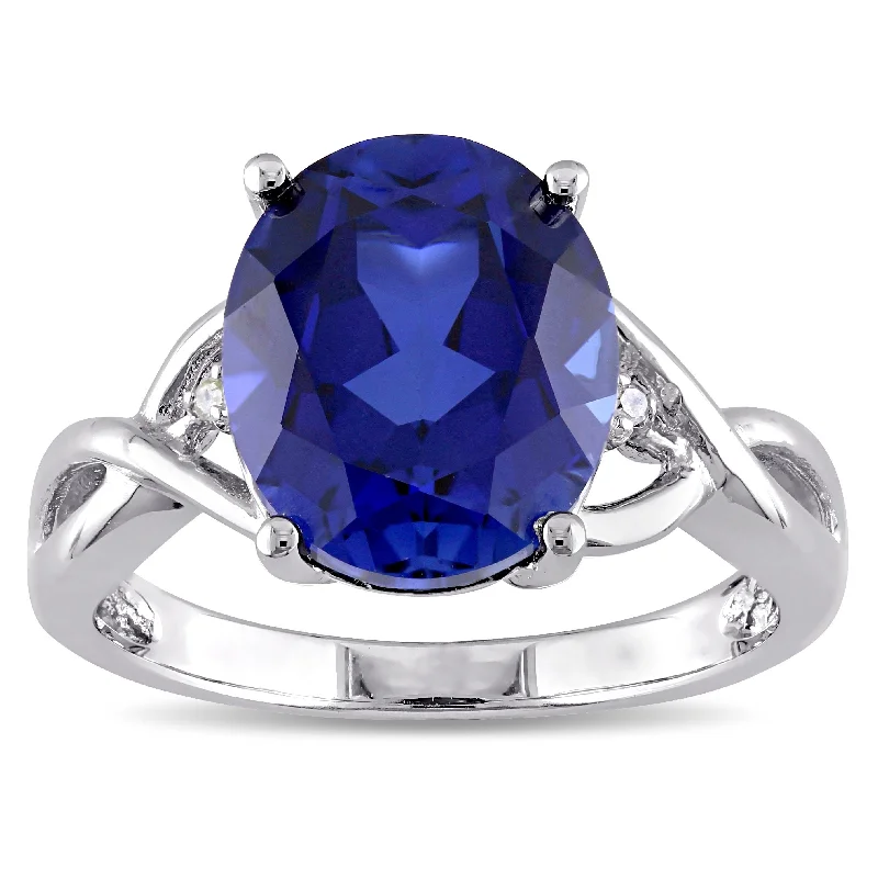 Women’s band rings-Miadora Sterling Silver Oval-Cut Created Blue Sapphire and Diamond Accent Crossover Ring